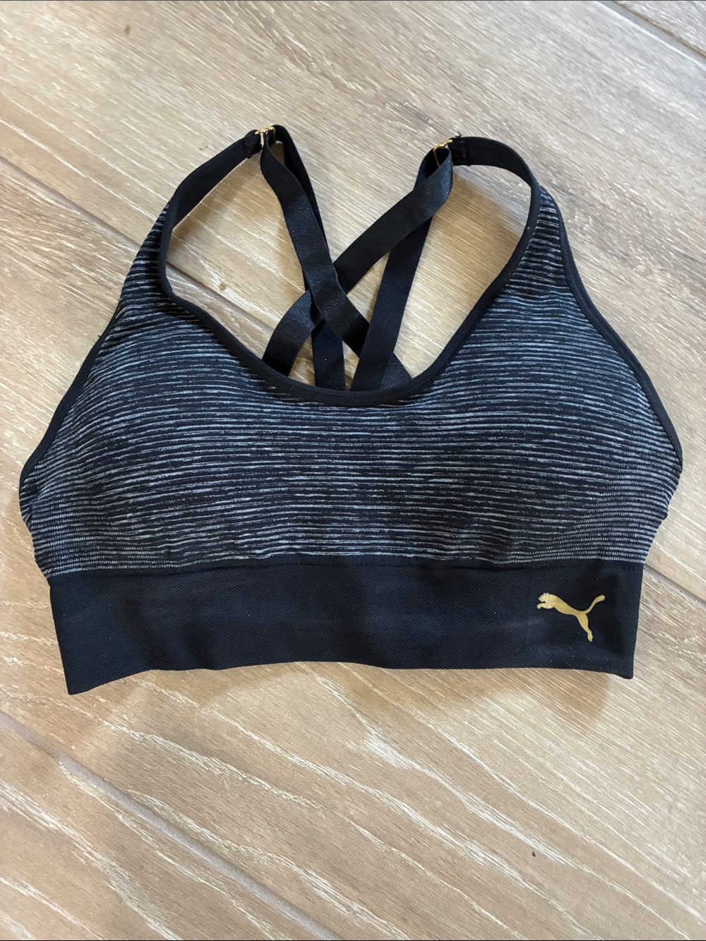 Puma Black and Grey Striped Crisscross Sports Bra with Gold Logo